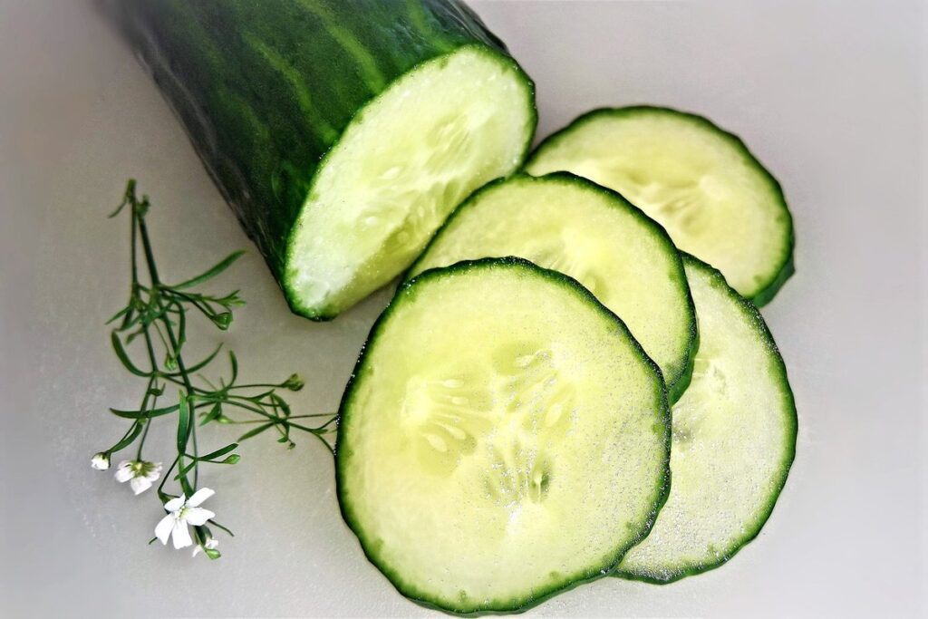 hand pollinating cucumbers